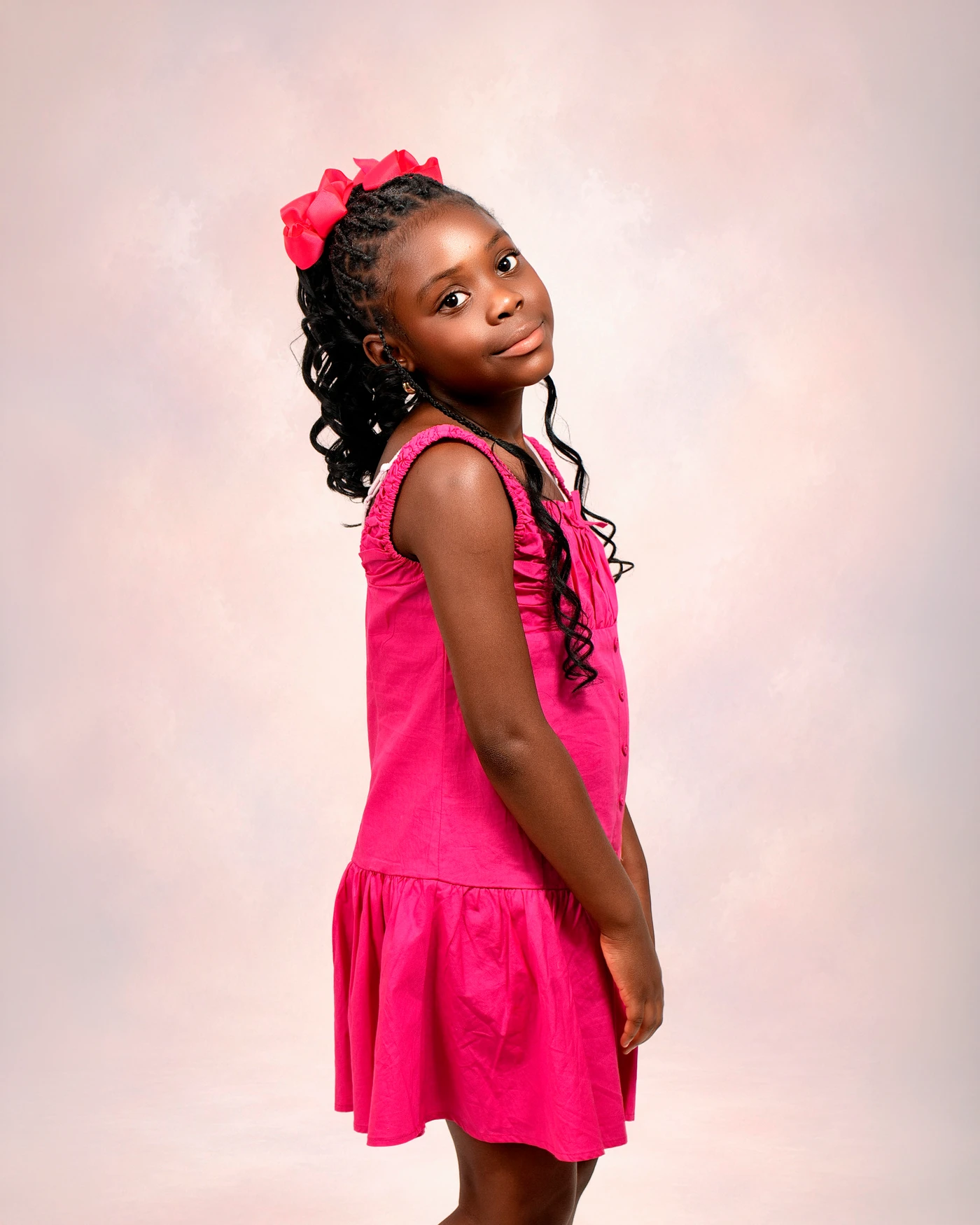 Child portrait in a pink dress at Afrikwave Studio