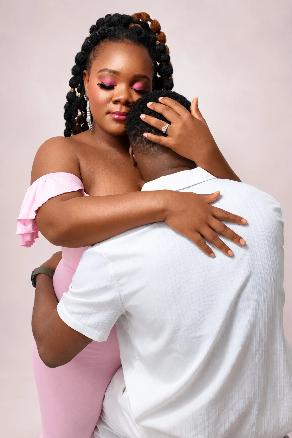 A couple sharing an embrace during their maternity session