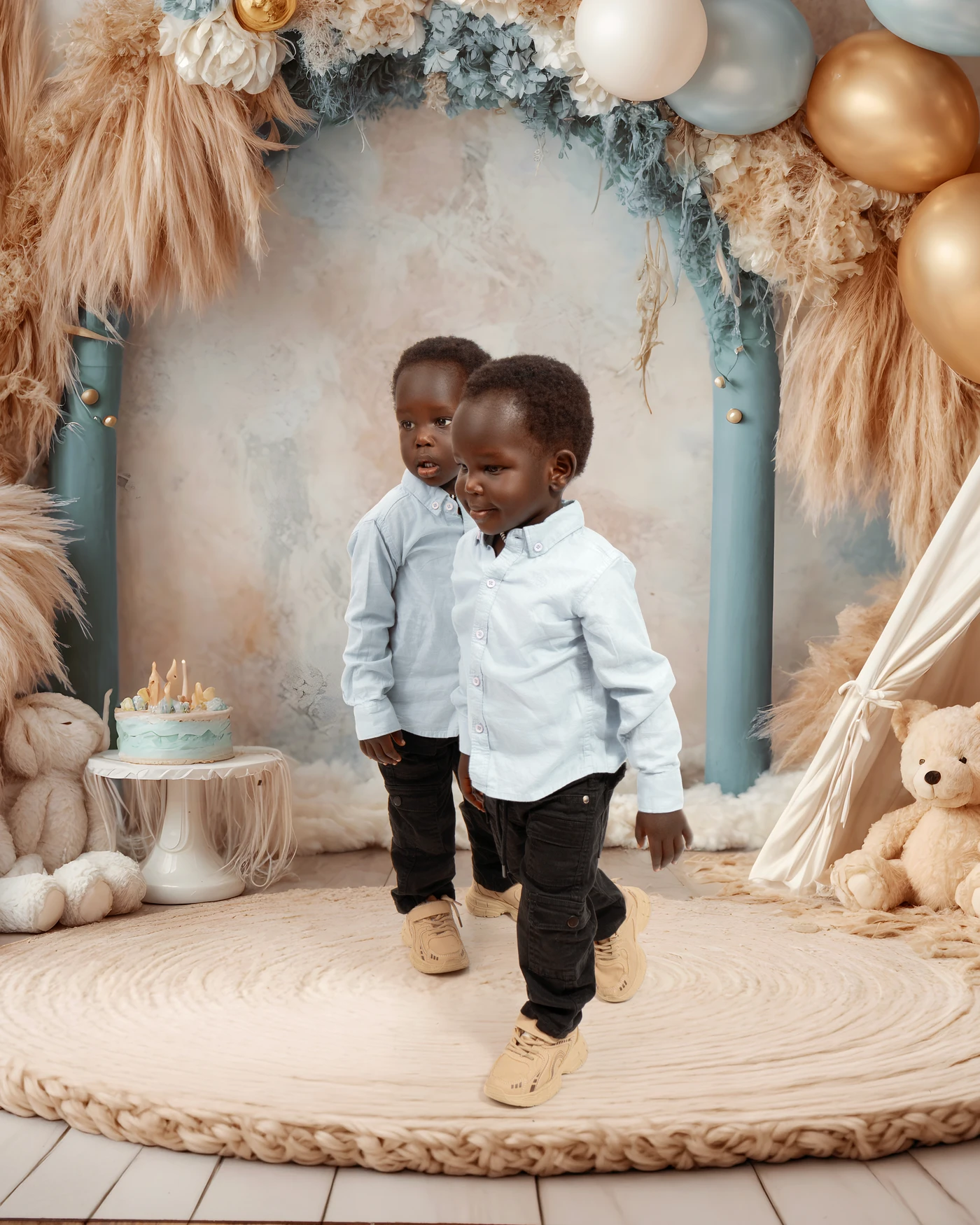 Two children exploring their birthday portrait set